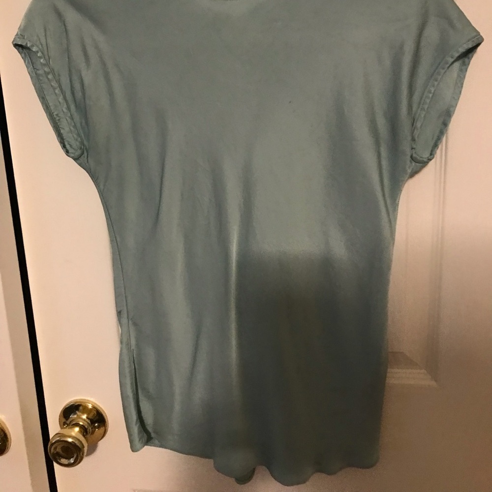 Green crew neck blouse.